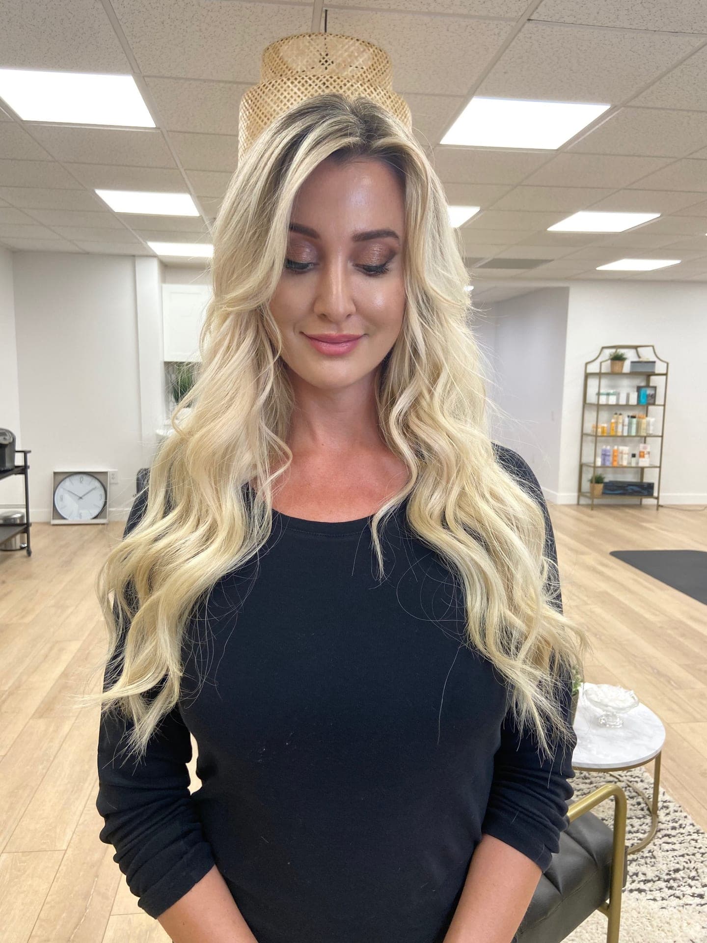 Diana's work — a finished hand tied extension install in soft waves