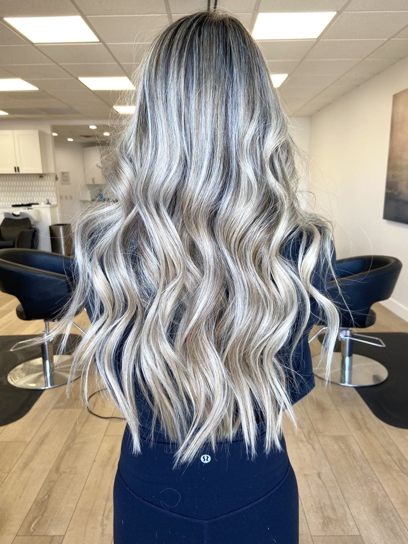 Long silver blonde hand tied extensions kept seamless between move ups