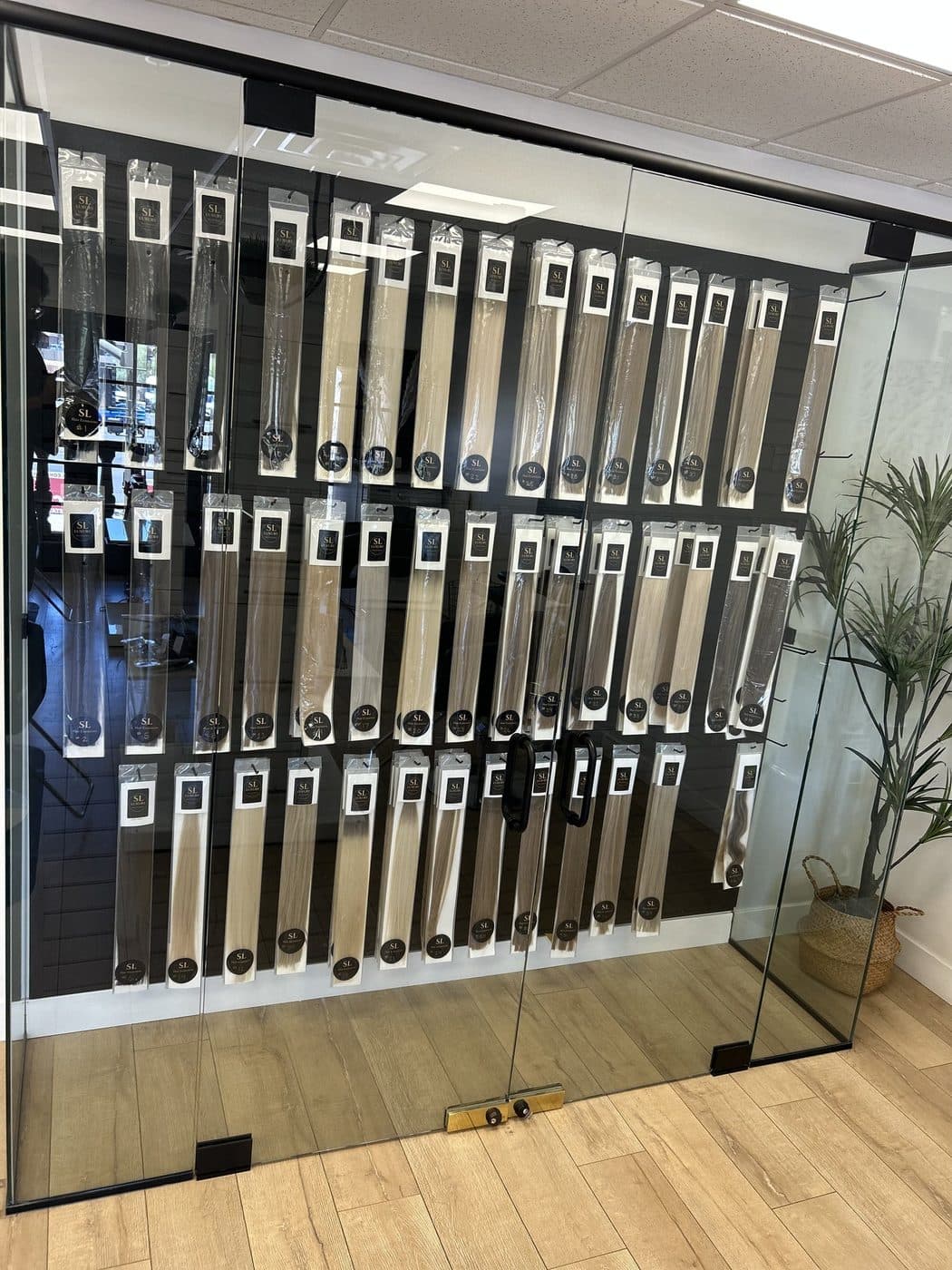 Signature Hair inventory wall, organized by color and length
